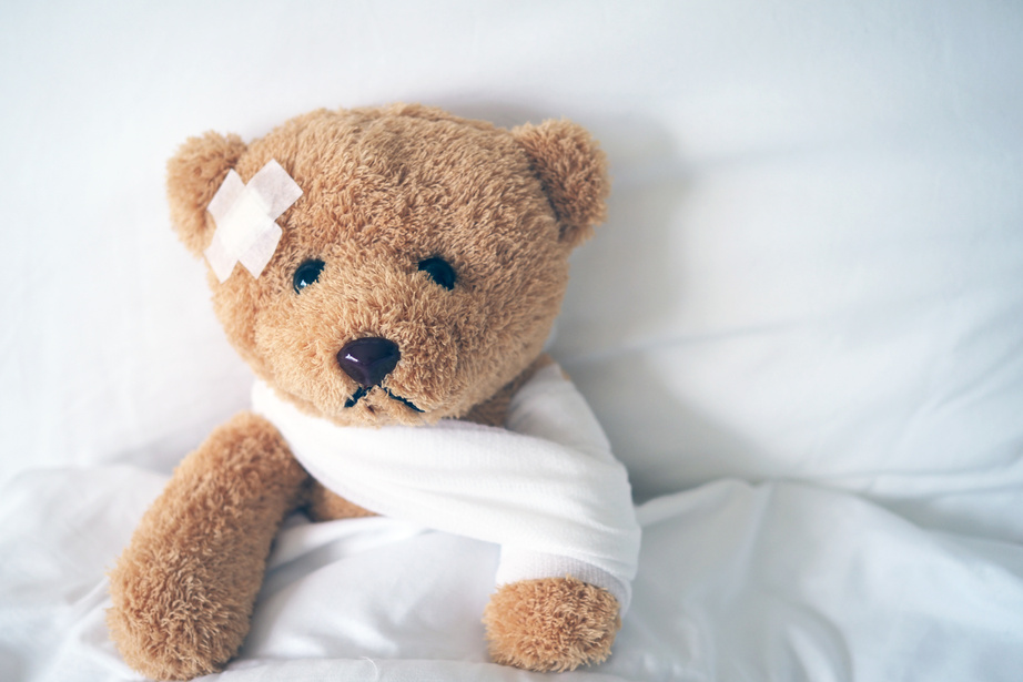 Teddy Bear Lying Sick in Bed 